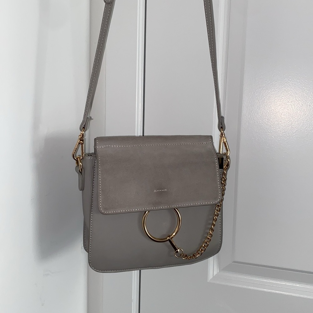 Light grey crossbody purse with gold chain detail